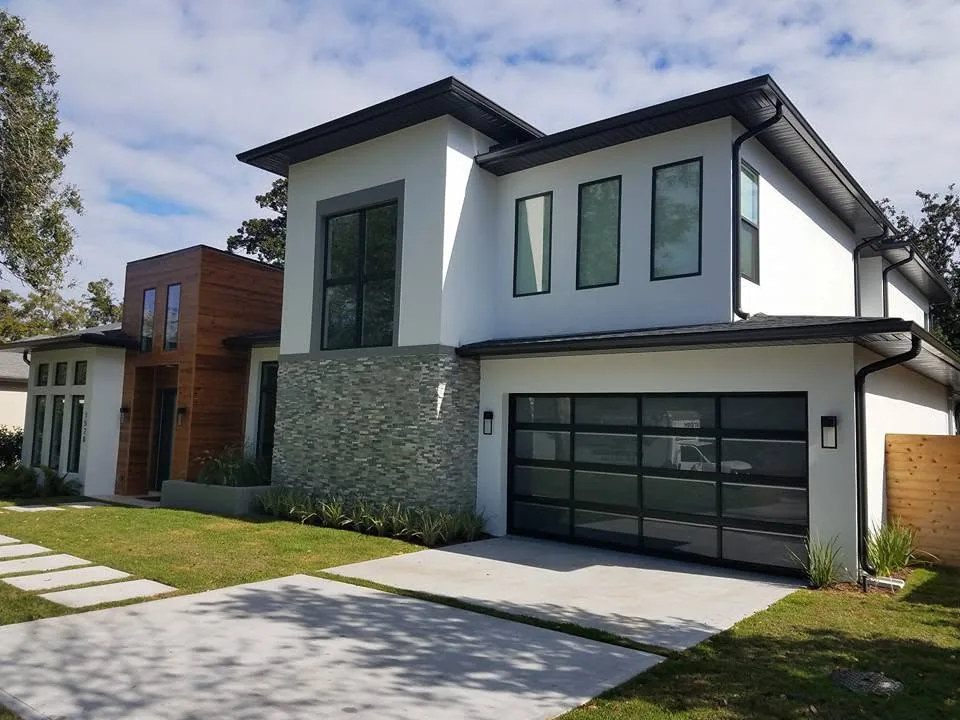 Modern white stucco cedar entry tower black gutters glass garage door, Sanford